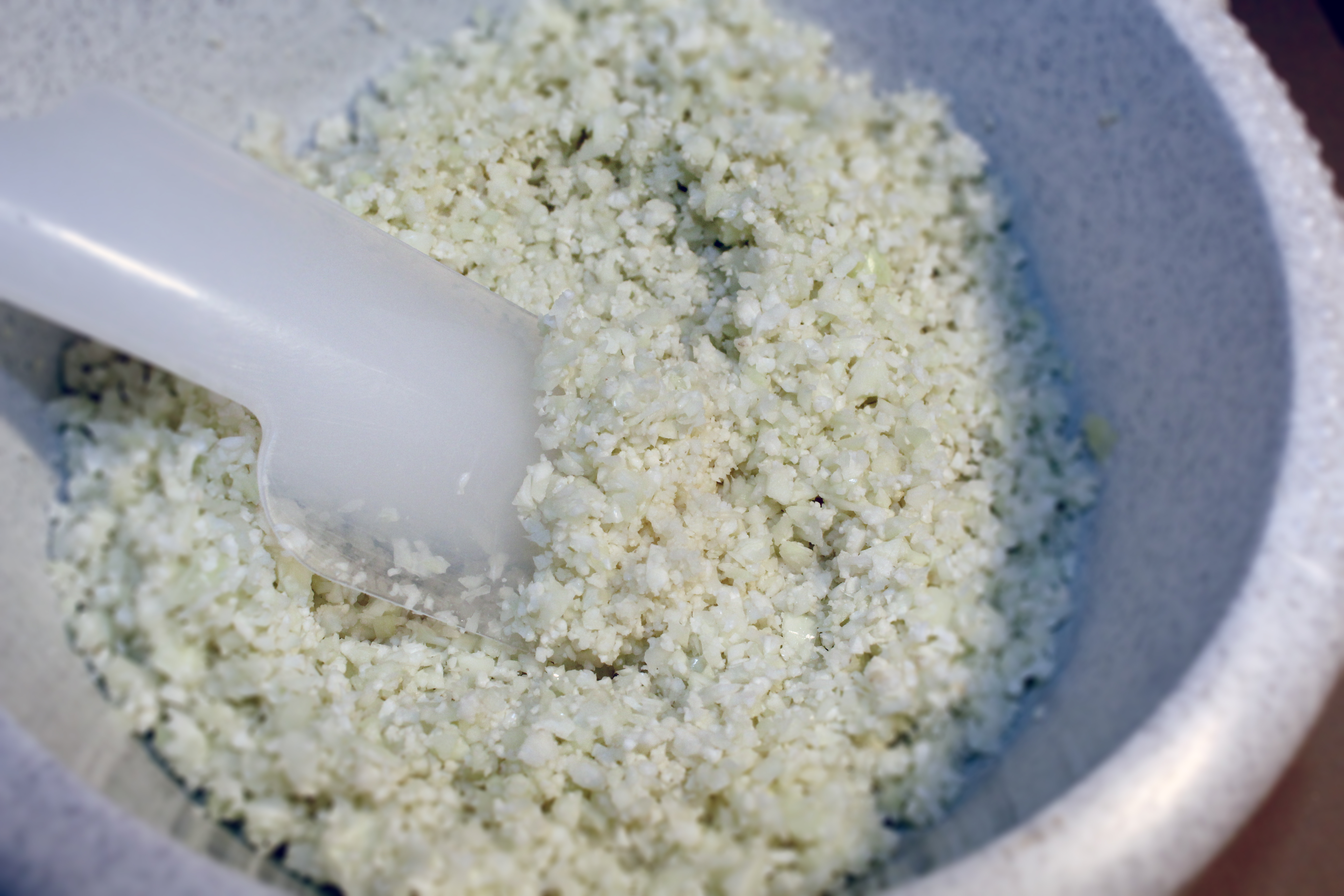 cauliflower rice : "Image result for how to make cauliflower rice Cut the hard core and stalks from the cauliflower and pulse the rest in a food processor to make grains the size of rice. Transfer to a clean towel or paper towel and press to remove any excess moisture, which can make your dish soggy."